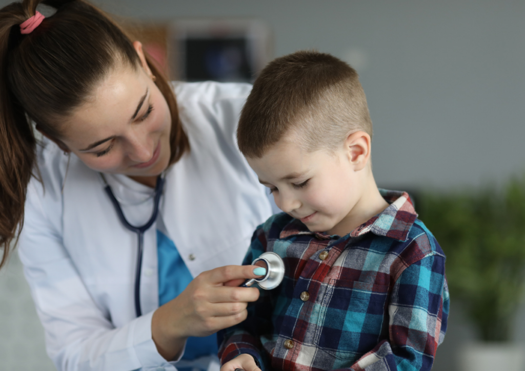 Healthcare provider examining a young child during a medical checkup.